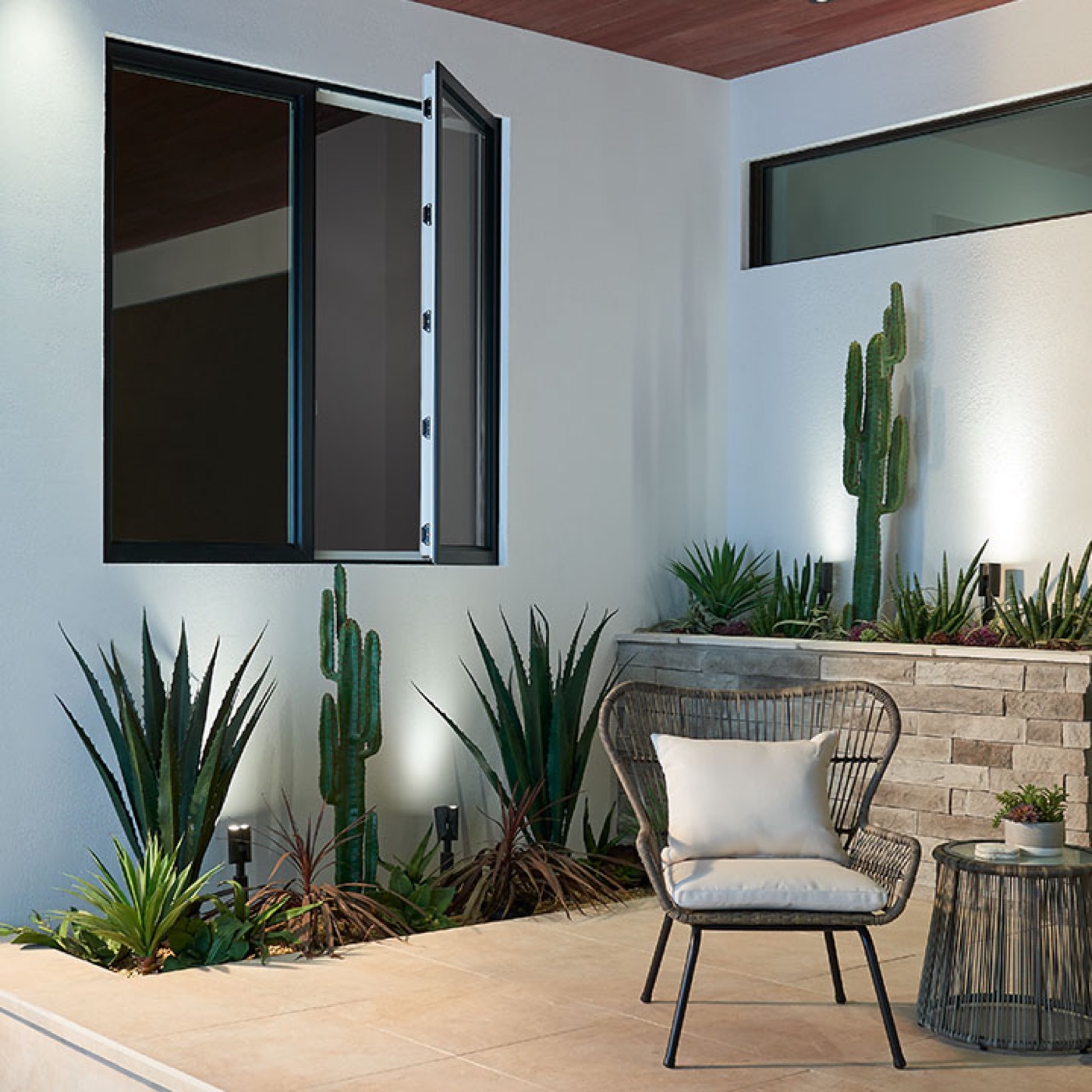 Ply Gem West Pro 700 black casement window open to a courtyard